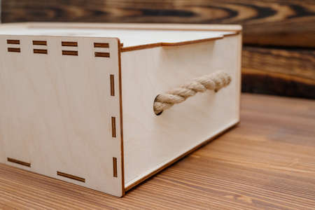 Wooden empty box on wooden background. Top view.Empty wooden box product material - plywood. wood...