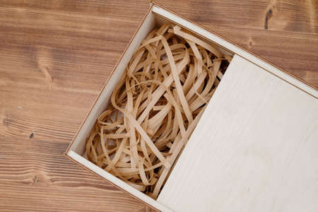Wooden empty box on wooden background. Top view.Empty wooden box product material - plywood. wood...