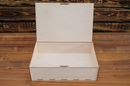 Wooden empty box on wooden background. Top view.Empty wooden box product material - plywood. wood...