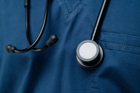 Black medical stethoscope.A doctor with a stethoscope.A doctor holding a stethoscope.The concept of...