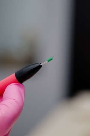 Electroepilation needle close-up. Hardware permanent of unwanted hair removal in the salon.の写真素材