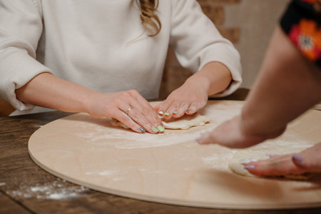 The pizza making process. Cooking homemade pizza. Woman cooking a pizza close upの写真素材