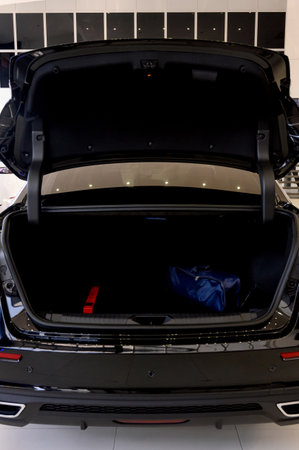 Large black empty car trunk. Open car trunk close up. Empty open trunk of a new modern carの写真素材