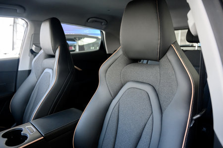 Interior of a modern car with black leather seats. Inside the car. Interior of a prestigious modern car. Comfortable black leather seatsの写真素材