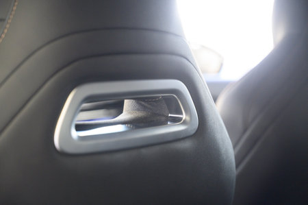 Close-up of black leather seat of modern car. The interior of a modern car with black leather seats.の写真素材