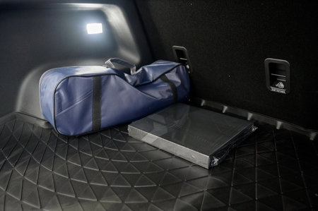 Large black empty car trunk. Open car trunk close up. Empty open trunk of a new modern carの写真素材