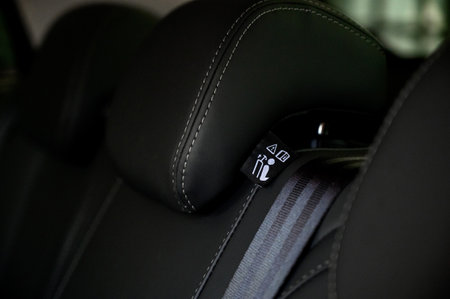 Close-up of black leather seat of modern car. The interior of a modern car with black leather seats.の写真素材