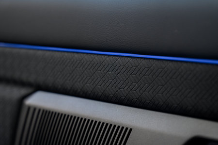 Car door inside close up with door handle and window control and adjustment buttonの写真素材