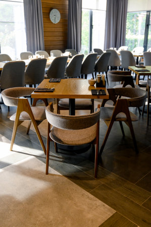 Restaurant or cafe interior with wooden tables and chairs. Restaurant, cafe or public space interior concept.の写真素材