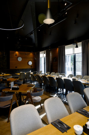 Restaurant interior with wooden tables and chairs. Restaurant, cafe or public space interior concept.の写真素材