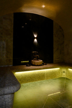 Interior of a hammam sauna with stone finishing and lighting. Spa or sauna relaxation room interior design.の写真素材