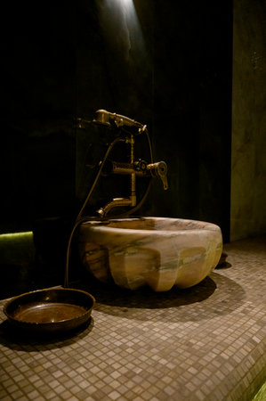 Interior of a hammam sauna with stone finishing and lighting. Spa or sauna relaxation room interior design.の写真素材