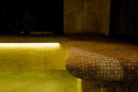 Interior of a hammam sauna with stone finishing and lighting. Spa or sauna relaxation room interior design.の写真素材