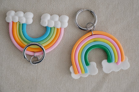 A close-up of handmade rainbow-shaped polymer clay keychains. Handmade jewelry. Rainbow keychains...