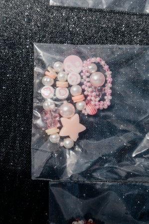 Handmade. A collection of children's beaded bracelets with cute figures and hearts.
