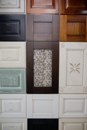 Samples of kitchen fronts in different colors and textures with a classic panel for design selectionの写真素材