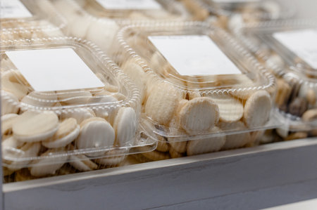 Close-up of packaged butter cookies with labels on supermarket shelfの写真素材