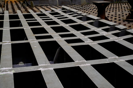 Metal base of a ship section with rectangular cells. The steel lattice structure of the ship's hull...