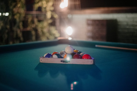 Billiard table with billiard balls close up.Billiard balls in a green pool table