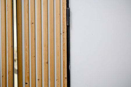 Sign for a coworking space displays event information on a wall with wooden paneling, showcasing...