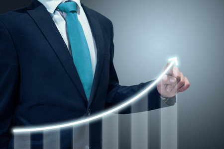 Businessman in suit drawing business growth data chart with diagram, report on company investment progress, quarterly report Q1/Q2/Q3/Q4, first/second/third/fourth quarterの写真素材