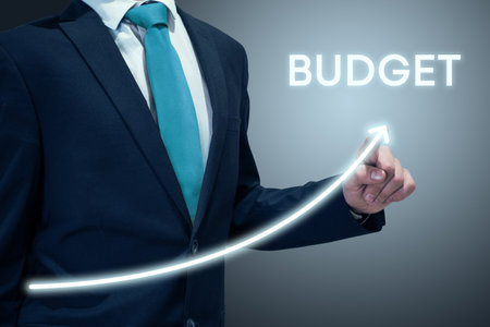 Businessman in suit drawing business growth data chart with diagram, report on company investment progress, quarterly report Q1/Q2/Q3/Q4, first/second/third/fourth quarterの写真素材