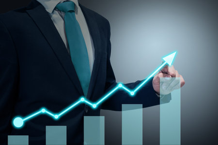 Businessman in suit drawing business growth data chart with diagram, report on company investment progress, quarterly report Q1/Q2/Q3/Q4, first/second/third/fourth quarterの写真素材