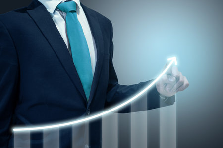 Businessman in suit drawing business growth data chart with diagram, report on company investment progress, quarterly report Q1/Q2/Q3/Q4, first/second/third/fourth quarterの写真素材