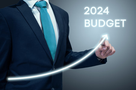 Businessman in suit drawing business growth data chart with diagram, report on company investment progress, quarterly report Q1/Q2/Q3/Q4, first/second/third/fourth quarterの写真素材