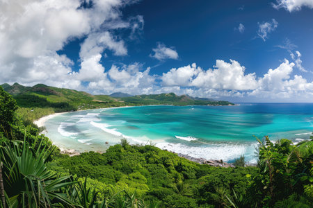A picturesque view of a tropical beach with white sand, turquoise waters, and lush green foliage.の素材