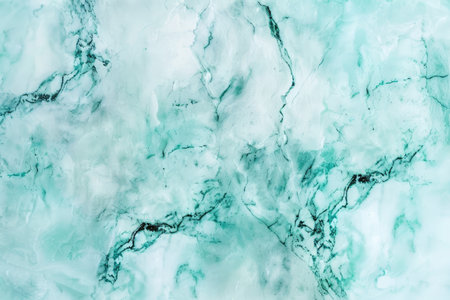 An abstract image of a light green and white marble surface with intricate veining.の素材