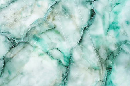 A close-up shot of green and white marble, revealing intricate veins and swirling patterns.の素材
