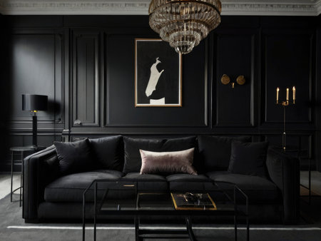 A modern, dark living room features a black velvet sofa, a glass coffee table, and a dramatic black and white artwork.の素材