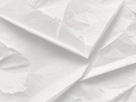 The image shows a close-up view of crumpled white paper creating an abstract texture.の素材
