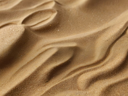 A close-up image reveals the intricate texture and patterns of desert sand dunes, formed by wind and sunlight.の素材