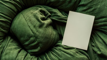 Blank card on green knitted background. Mockup for designの素材