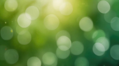 green bokeh background from nature under tree shade with sun lightの素材