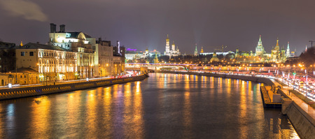 Night view of illuminated Moscow river with car tracery and Kremlin background on the horizon lineの写真素材