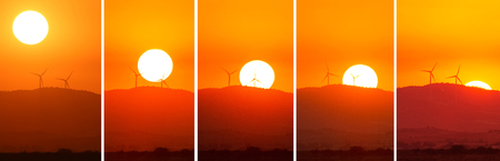 Sunset sequence from view fom salt lake of Larnaca with silhouettes of wind power generators
