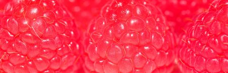 Macrophotography of surface of red juicy sweet raspberry close up