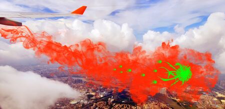 Concept of coronavirus global attack on background of flying aircraft wing and toxic smoke with virusesの写真素材