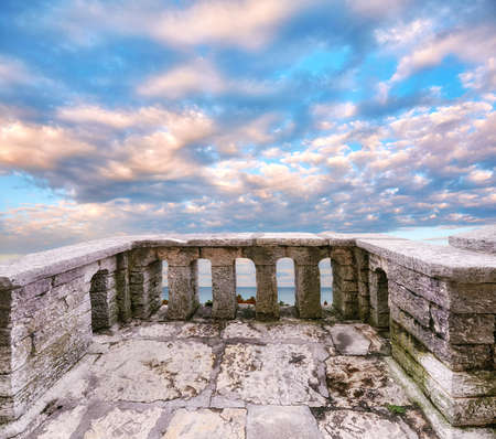 Ancient stone balcony in fortress in Sochi in cloudy morningの写真素材