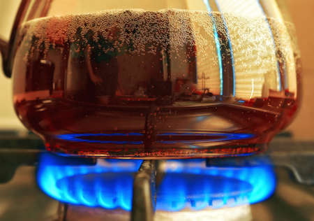 Pu-erh hot tea brewing using blue gas flameの写真素材