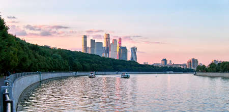 Early autumn sunset over Moscow river under dramatic skyの写真素材
