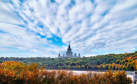 Silhouette of famous Russian university in early autumn day near Moscow river under dramatic cloudy skyの写真素材