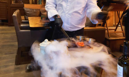 Cutting hot meat in Moscow restaurantの写真素材