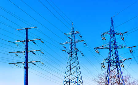 Electric power line in Moscow on background of blue spring sky