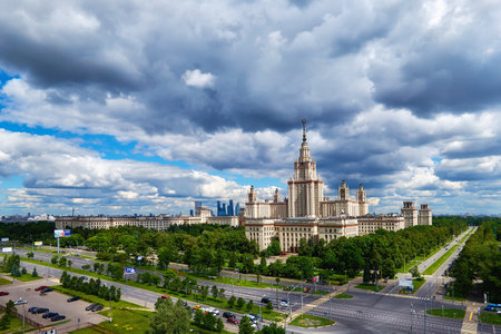 Moscow, Russia - April 17 2021: Aerial panoramic view of sunny campus buildings of famous Moscow university under dramatic cloudy sky in springのeditorial素材