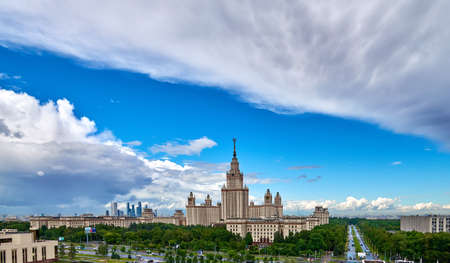 Moscow, Russia - April 17 2021: Aerial panoramic view of sunny campus buildings of famous Moscow university under dramatic cloudy sky in springのeditorial素材
