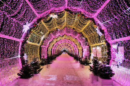 Moscow, Russia - December 25 2021: New year and Xmas street decoration in night illuminated Moscow, LED light tunnelのeditorial素材